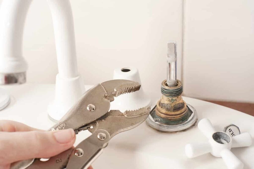 Repairing a faucet with a mole grip pliers